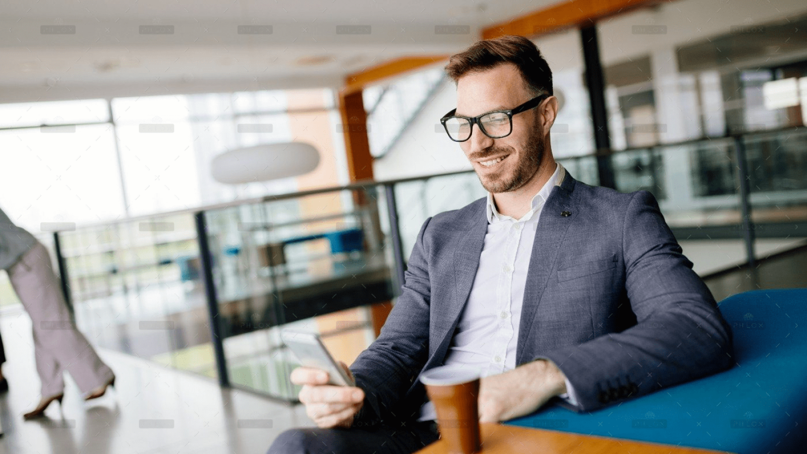 demo-attachment-478-businessman-taking-a-break-with-a-cup-of-coffee-JW4B3DH